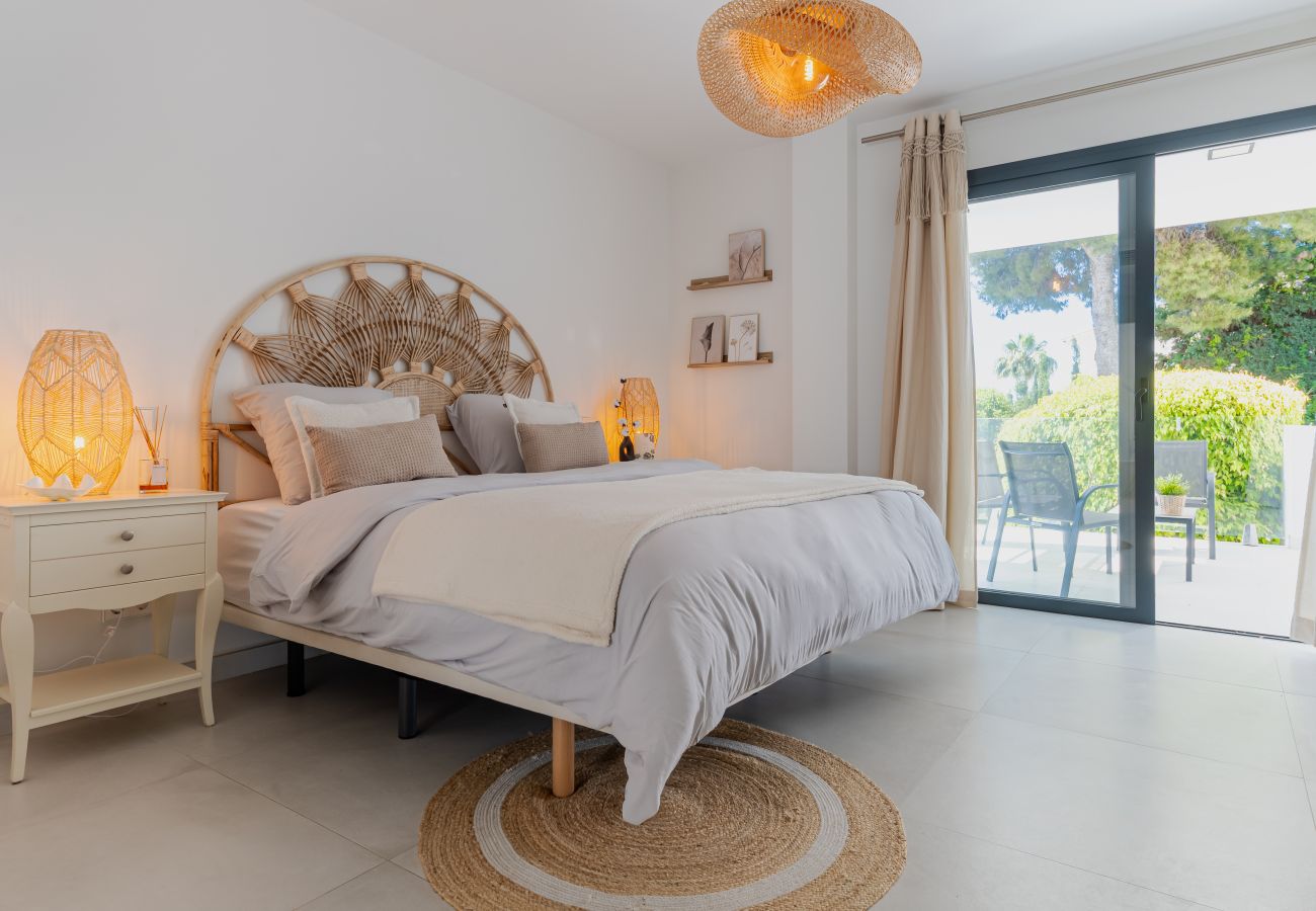 Elegant master bedroom with private terrace in luxury Marbella villa
