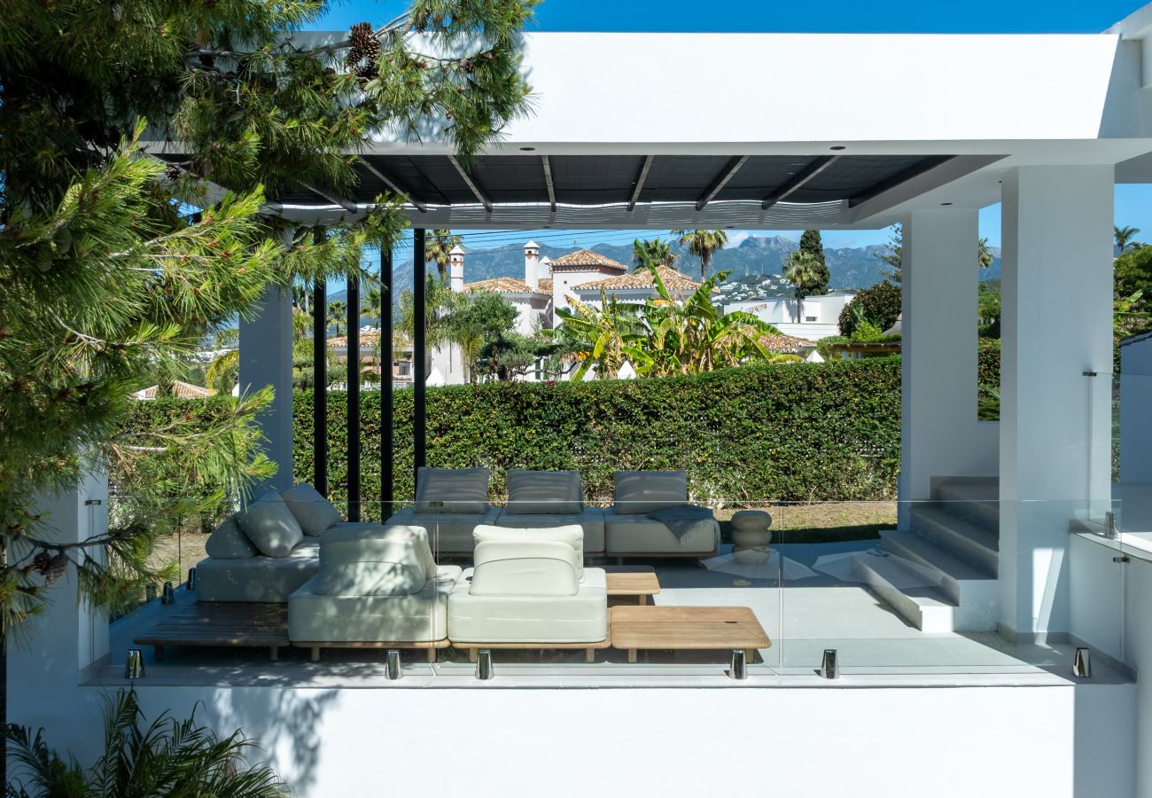 Modern Marbella villa terrace with luxury outdoor lounge